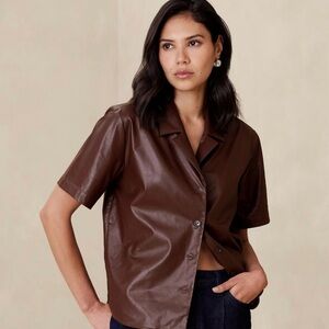 Subtle & oh so chic. Vegan leather button up short sleeve shirt.